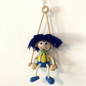 Panáček vlasatec na houpačce